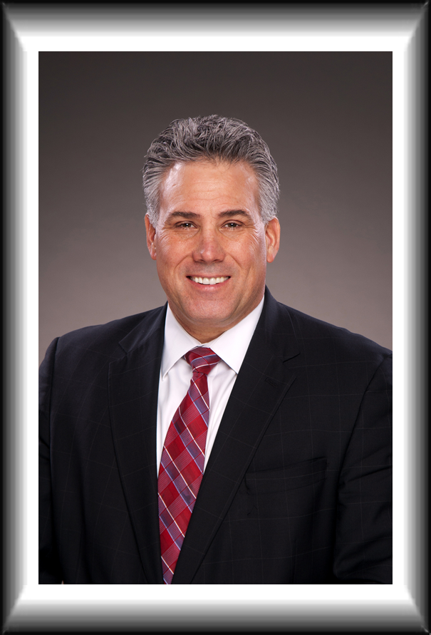 Hal in front of sign